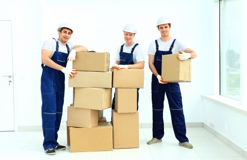 Moving van and packed boxes for removals in Feltham