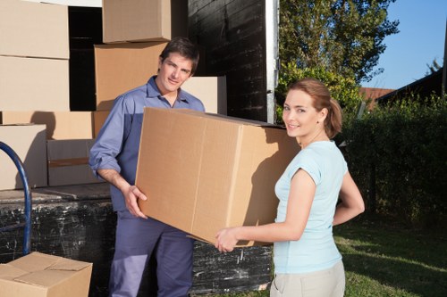 Family moving items into storage in Feltham
